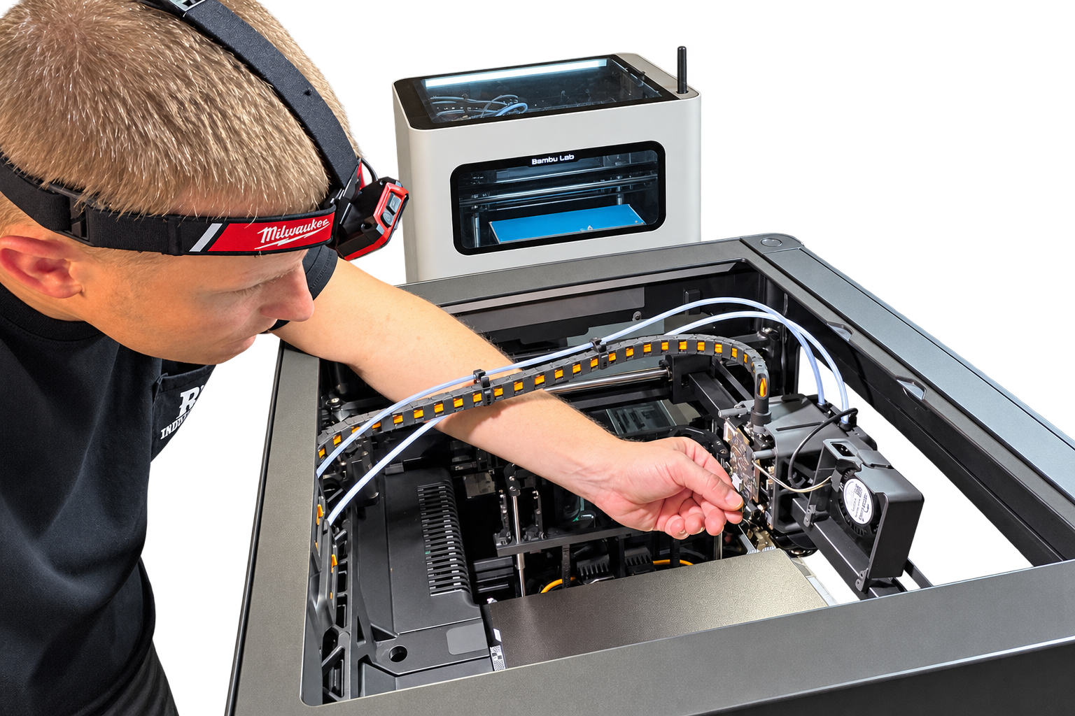 Rocket3D owner and technician servicing an opened Bambu Lab 3D printer